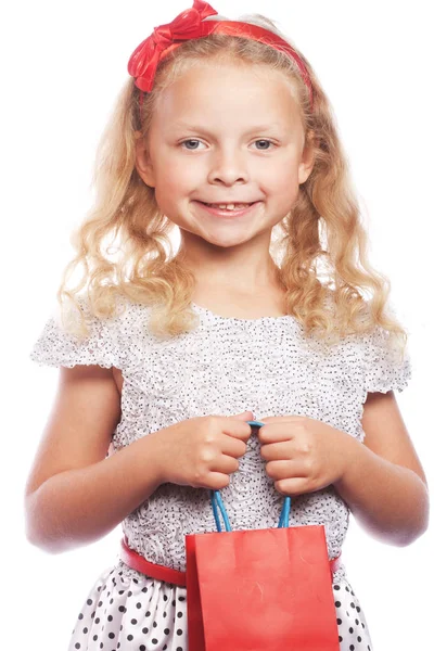 Menina com saco de compras vermelho — Fotografia de Stock