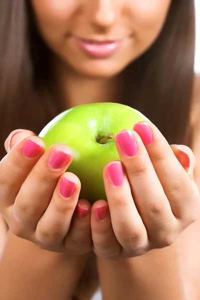 Young woman holding a green apple — Stock Photo, Image