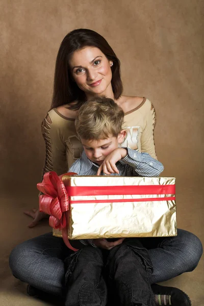 Woman and boy checking presents — Stock Photo, Image