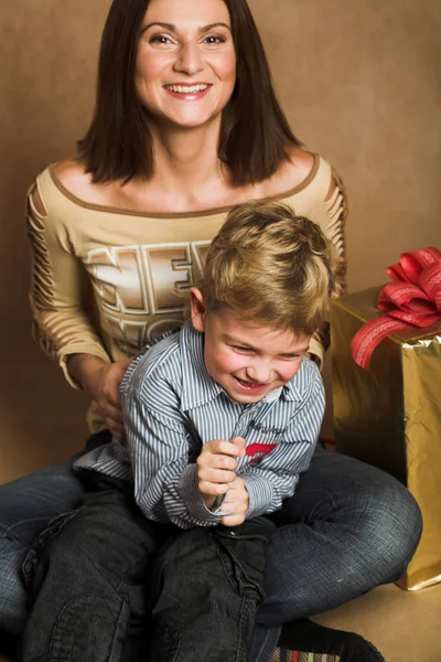 Woman and boy checking presents — Stock Photo, Image