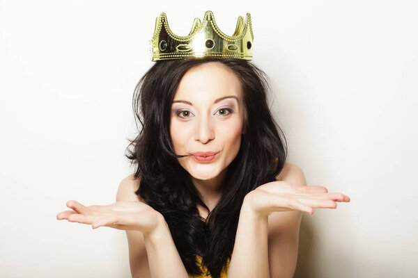 pretty brunette woman wearing crown