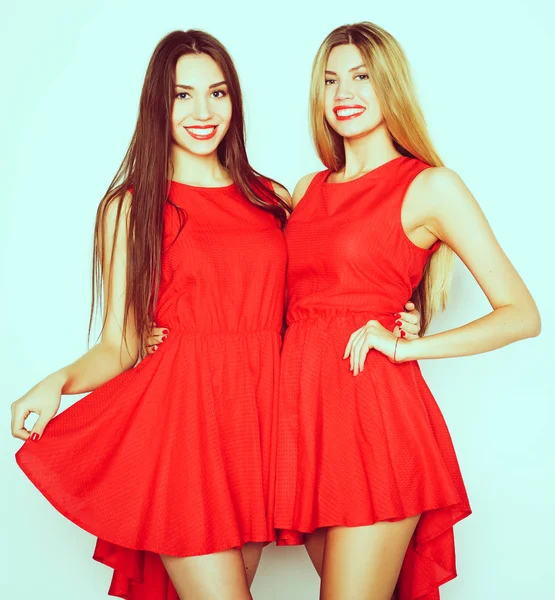 Young girls in red dress on white background — Stock Photo, Image