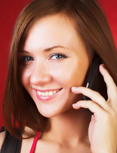 Smiling woman with a cellphone — Stock Photo, Image