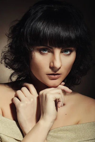 Portrait of a young woman with curly hair — Stock Photo, Image