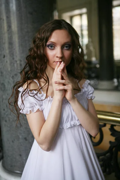 Beautiful young victorian lady in white dress — Stock Photo, Image