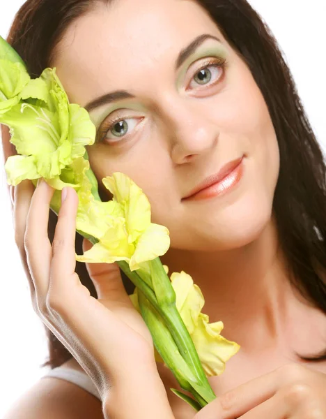 Rosto fresco com flores de gladíolo nas mãos — Fotografia de Stock