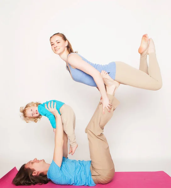 Lifestyle, sport  and people concept: family yoga — Stock Photo, Image