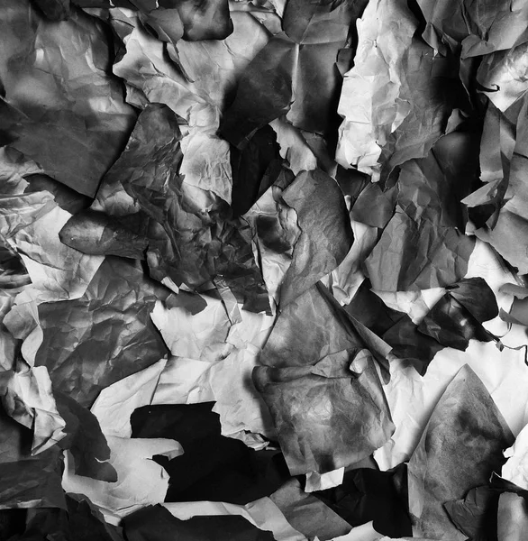 Background of fragments of crumpled paper, black and white — Stock Photo, Image