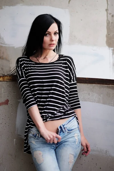 Beautiful young woman in a striped T-shirt — Stock Photo, Image