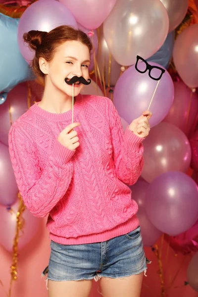 Party concept: happy girl with  fake mustaches and glasses. — Stock Photo, Image