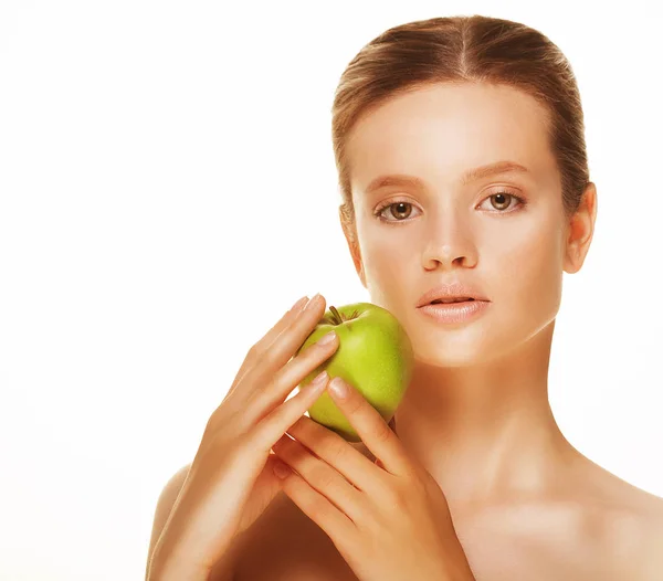 Head shot of woman holding green apple against white background — Stock Photo, Image