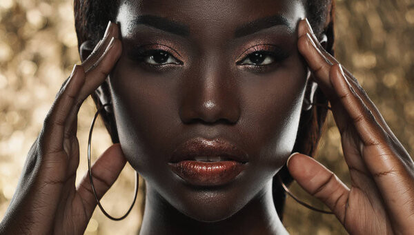 Close up portrait of sensual young african woman against golden background