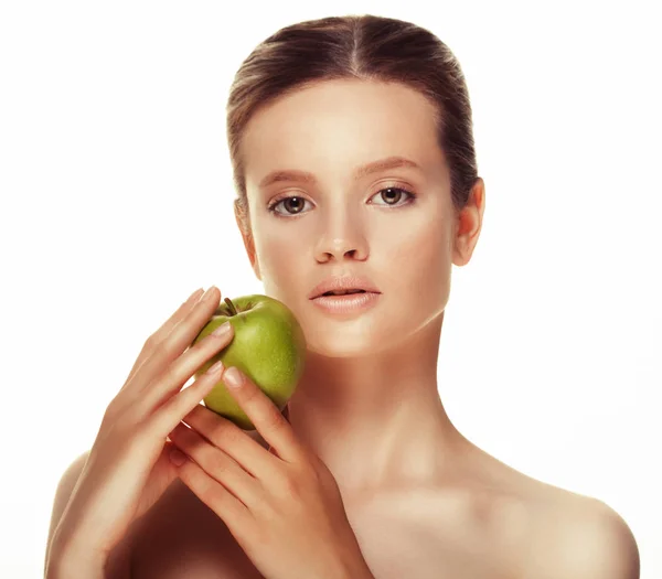 Mujer joven con manzana verde, aislada sobre fondo blanco — Foto de Stock