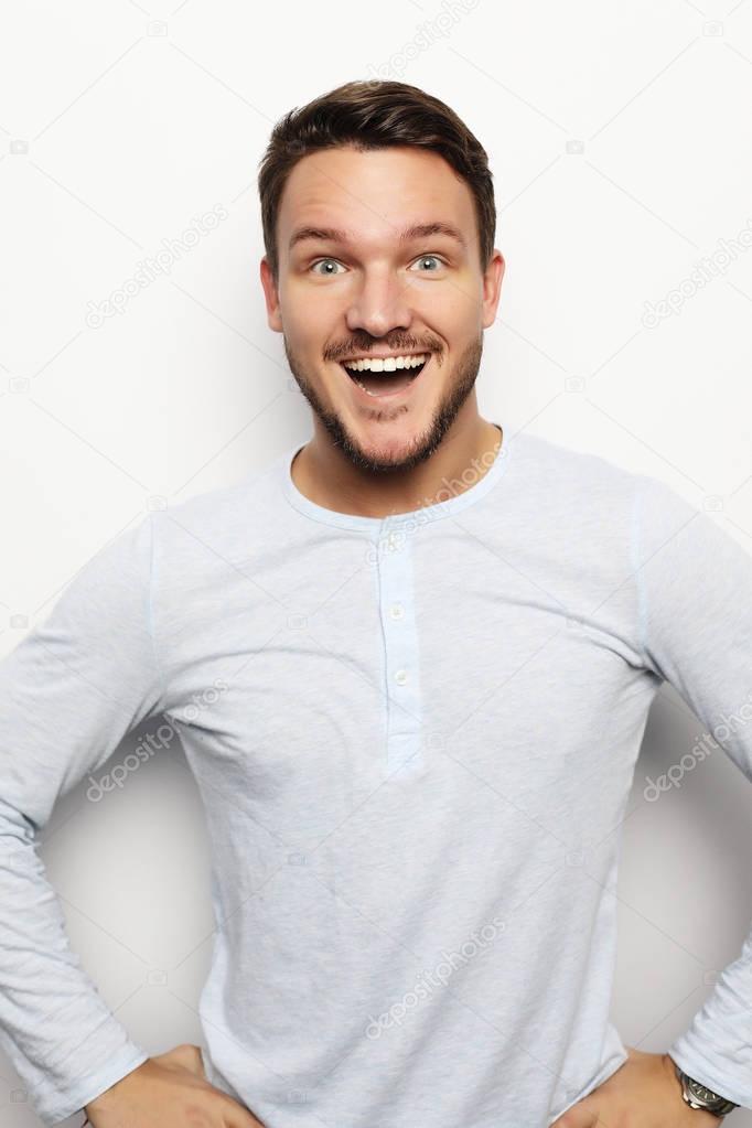 portrait of a young  man surprised face expression