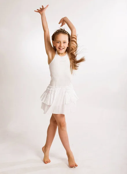 Little girl in white dress Stock Photo by ©kanareva 164648486