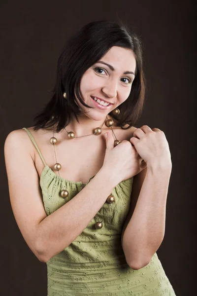 Pretty woman in green dress — Stock Photo, Image