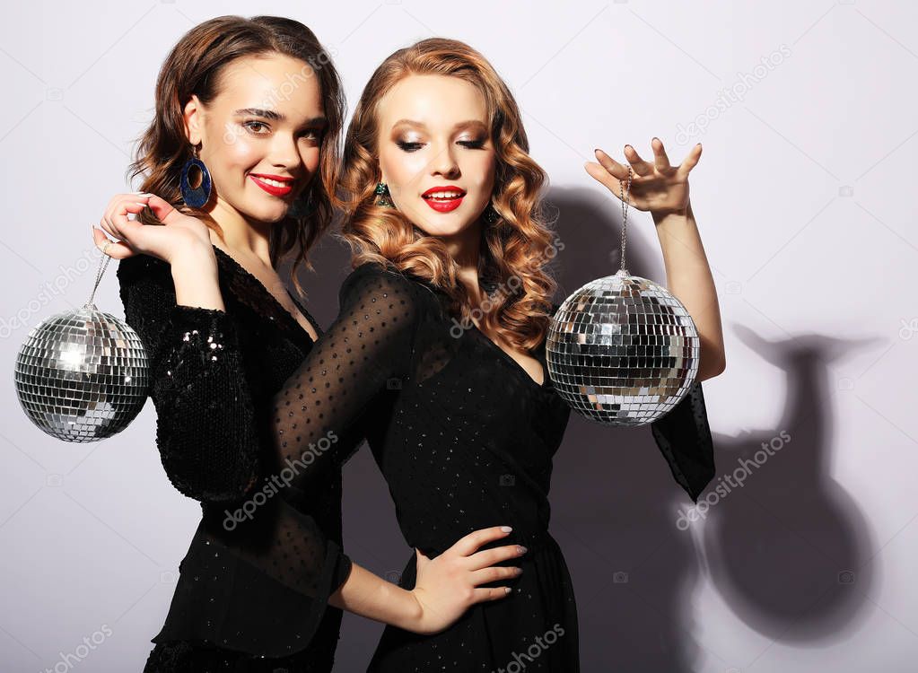 party and people concept: Party girls with disco balls