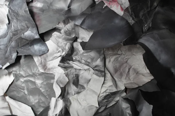 Monochrome background of torn pieces of black and white paper — Stock Photo, Image