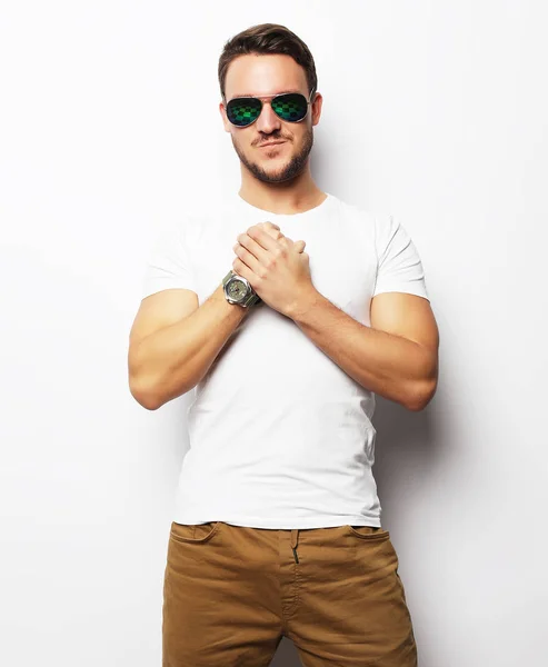 Young man in smart wear, wearing fashion sunglasses against whit — Stock Photo, Image