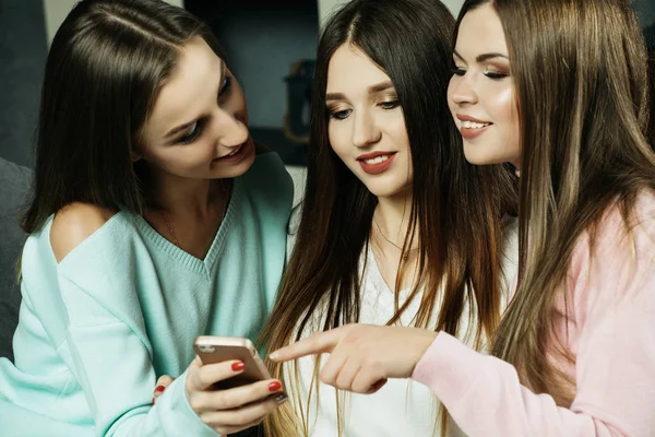 friendship, people and technology concept - happy friends or teenage girls with smartphone at home