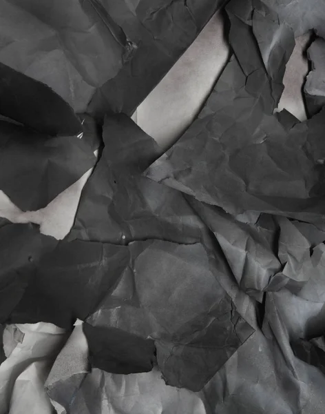 Siyah beyaz kağıt parçalarının tek renkli arkaplanı — Stok fotoğraf
