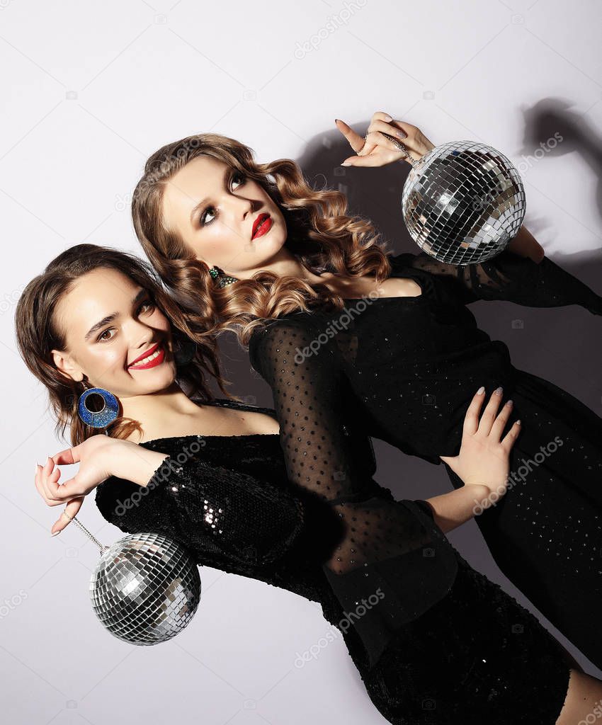 party and people concept: Party girls with disco balls