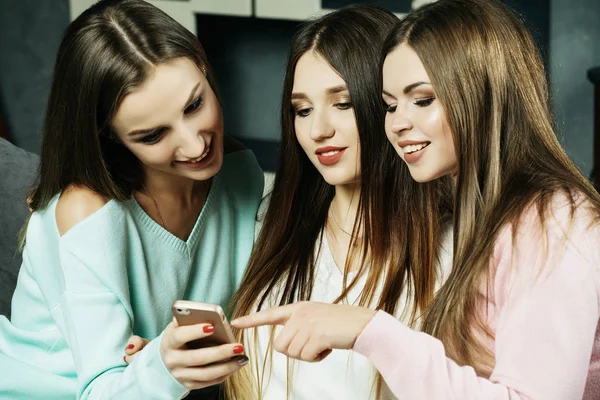 friendship, people and technology concept - happy friends or teenage girls with smartphone at hom