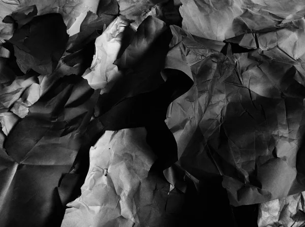 Background of fragments of crumpled paper, black and white — Stock Photo, Image