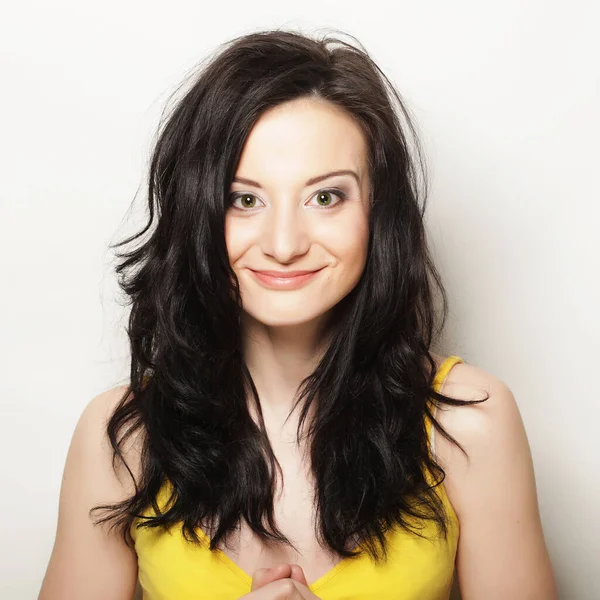 Cute smiling brunette girl on white background — Stock Photo, Image