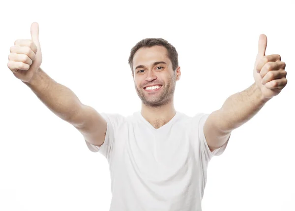 Счастливый красивый мужчина показывает большие пальцы вверх — стоковое фото