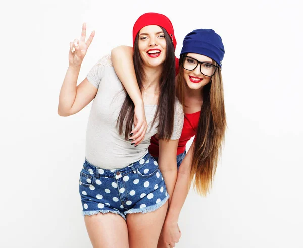 Two young girl friends standing together and having fun. — Stock Photo, Image