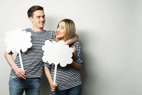 Amorous couple holding blank paper on stick. — Stock Photo, Image