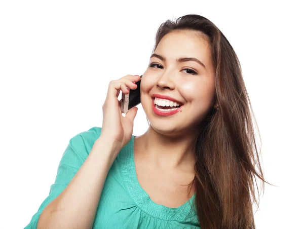 Cheerful woman talking on the phone isolated on a white backgrou — Stock Photo, Image