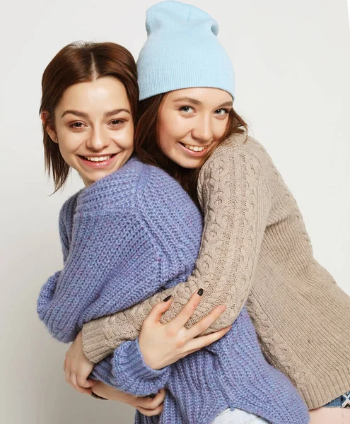 Two pretty teen girlfriends smiling hugs and having fun — Stock Photo, Image