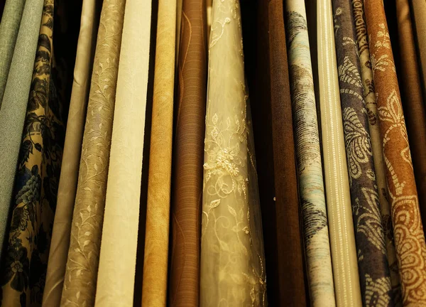 Rolls of fabric and textiles in store