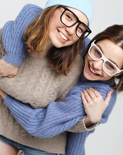 Two pretty teen girlfriends smiling hugs and having fun — Stock Photo, Image