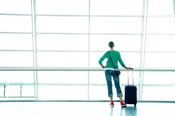 Woman with case in airport — Stock Photo, Image