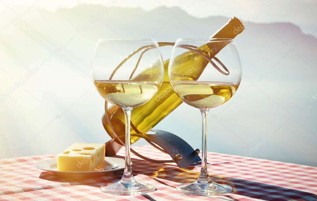 Wine in glasses against Geneva lake
