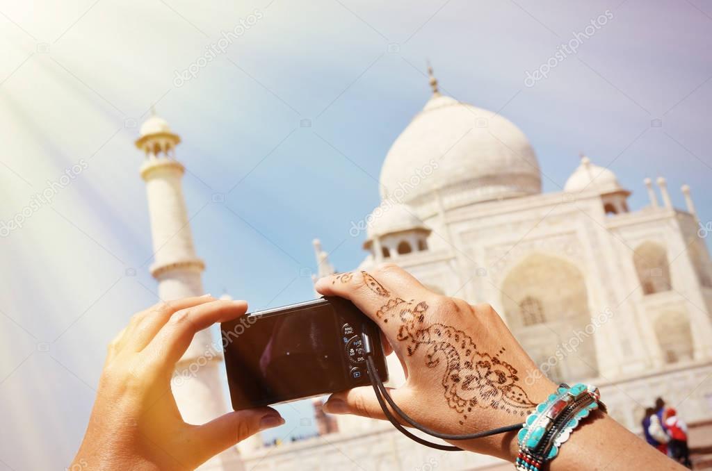 Person taking photo of Taj Mahal