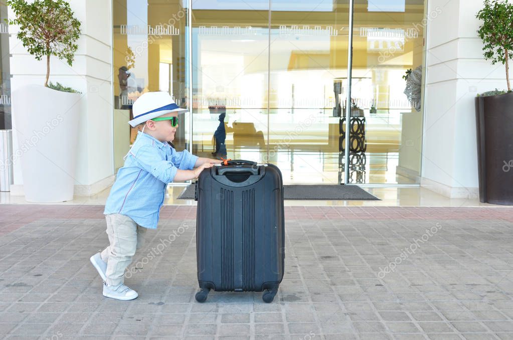  little boy with a suitcase