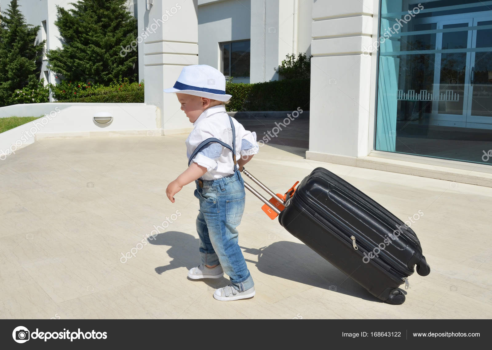 Little boy with a suitcase Stock Photo by ©happyalex 168643122