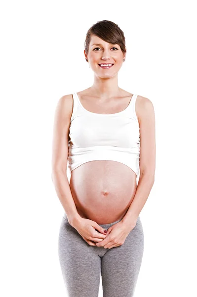 Schwangere streichelt ihren Bauch über weißem Hintergrund — Stockfoto