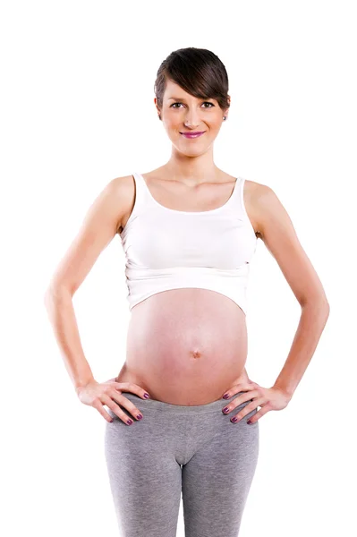 Piękna kobieta w ciąży - na białym tle nad biały deseń — Zdjęcie stockowe