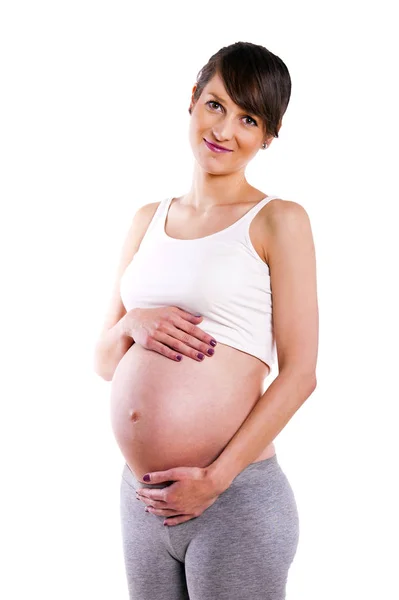 Schöne schwangere Frau - isoliert über einem weißen Hintergrund — Stockfoto