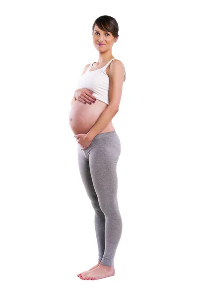 Vackra gravid kvinna - isolerade över en vit bak — Stockfoto