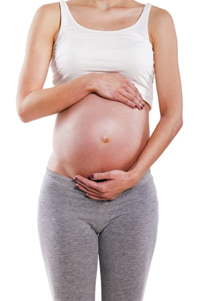 Närbild av en söt gravid mage — Stockfoto