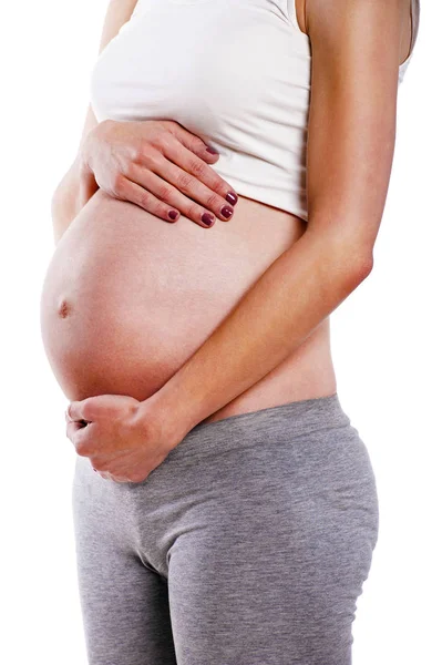 Närbild av en söt gravid mage — Stockfoto