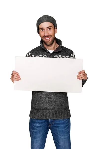 Man with white board in warm clothing, copy space. — Stock Photo, Image