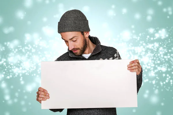 Christmas man with big blank board over snow backround. — Stock Photo, Image