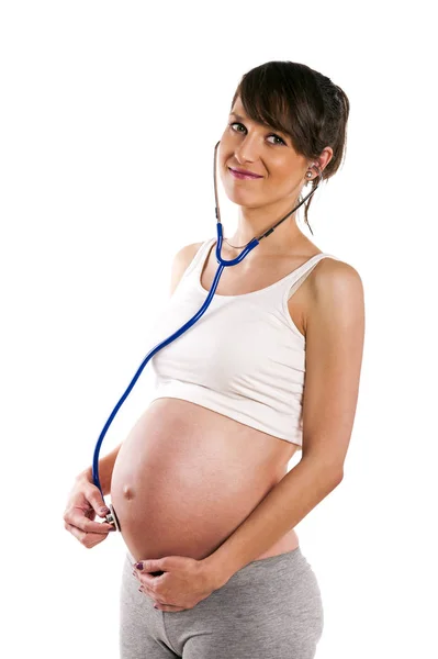 Femme enceinte écouter avec stéthoscope son bébé. Ventre enceinte — Photo